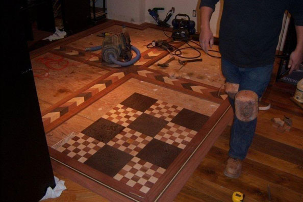 Handcrafted chessboard floor almost completed.