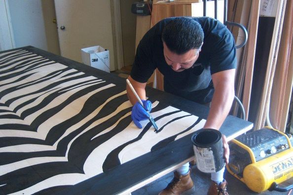 The stripes and border are painted with Ebony floor stain, then finished with polyurethane.