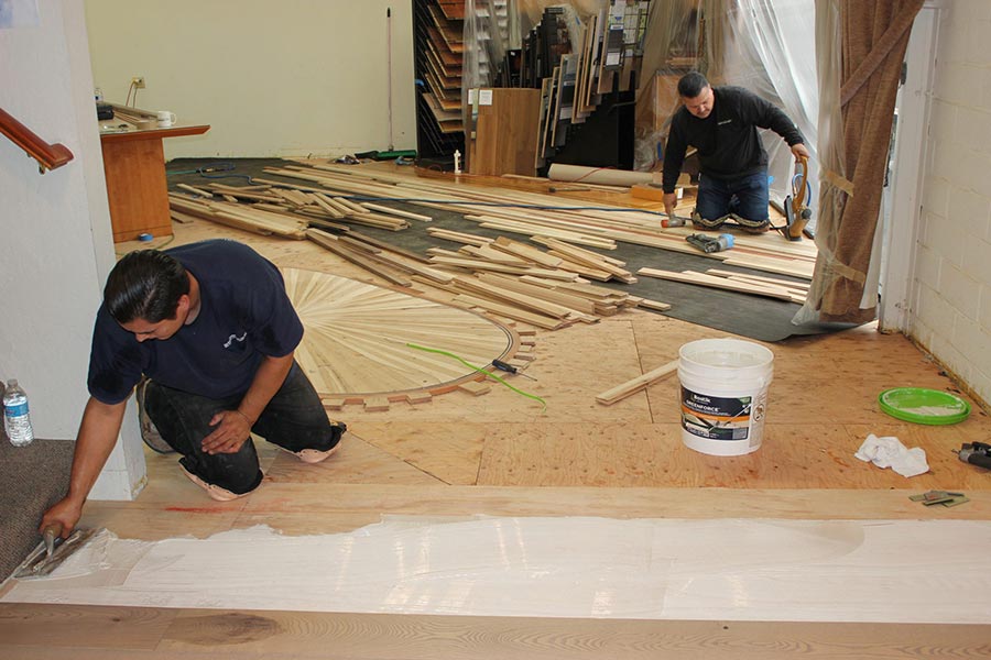 Gluing down the new flooring | Slaughterbeck Floors