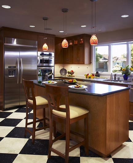 Checkerboard floor installation in kitchen.