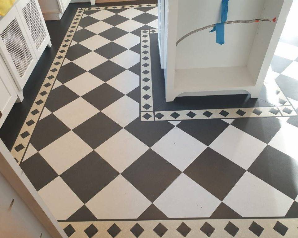 A new Forbo Marmoleum Linoleum floor installed in the kitchen with a checkerboard design.