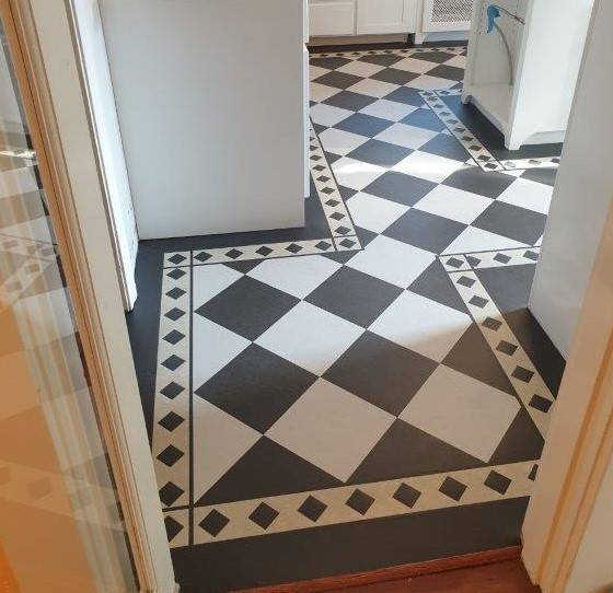 A new Forbo Marmoleum Linoleum floor installed in the kitchen with a checkerboard design.