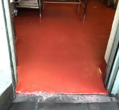 This epoxy floor was applied in a restaurant storage area by Slaughterbeck Floors